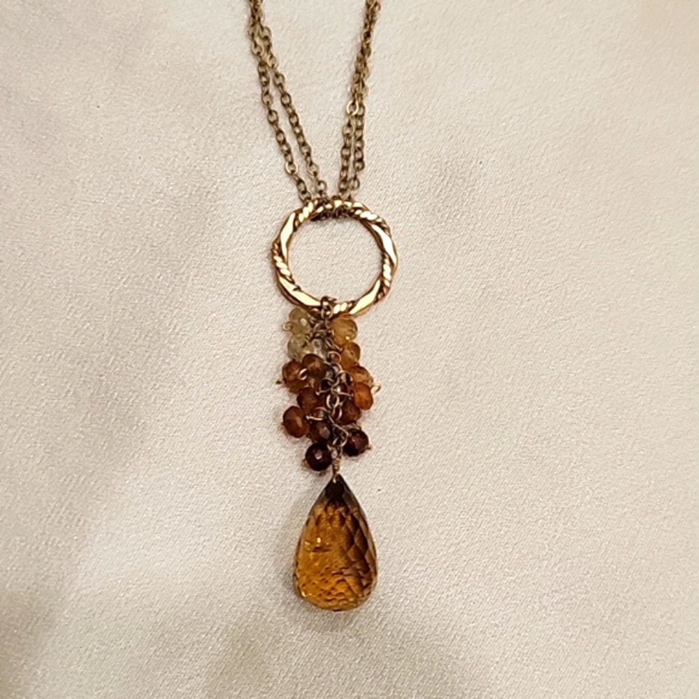 Amber pendant on gold chain